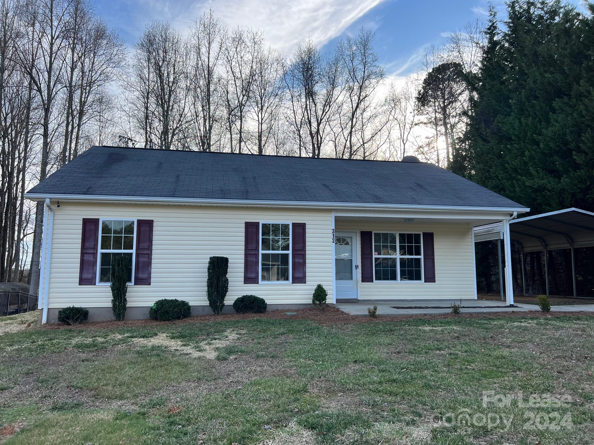 front view of a house with a yard