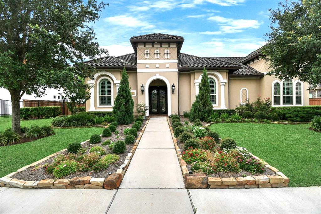 Stunning stucco home in gated community
