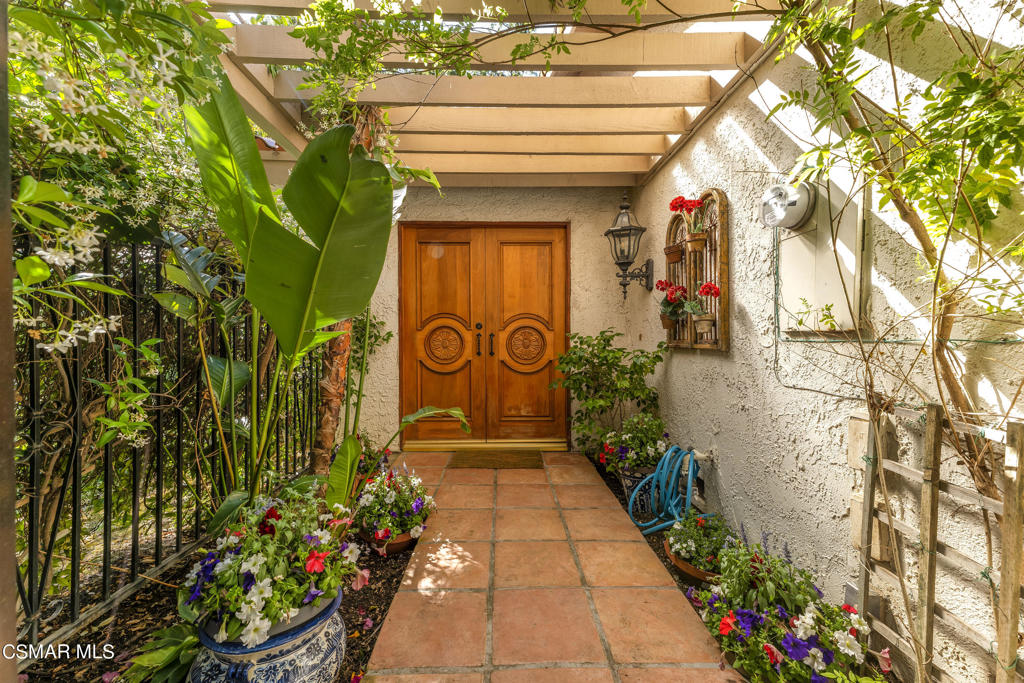 a bunch of flowers in front of a house