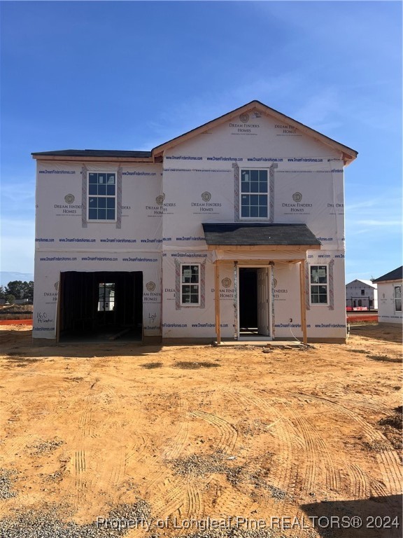 a large house with a large space in front of it