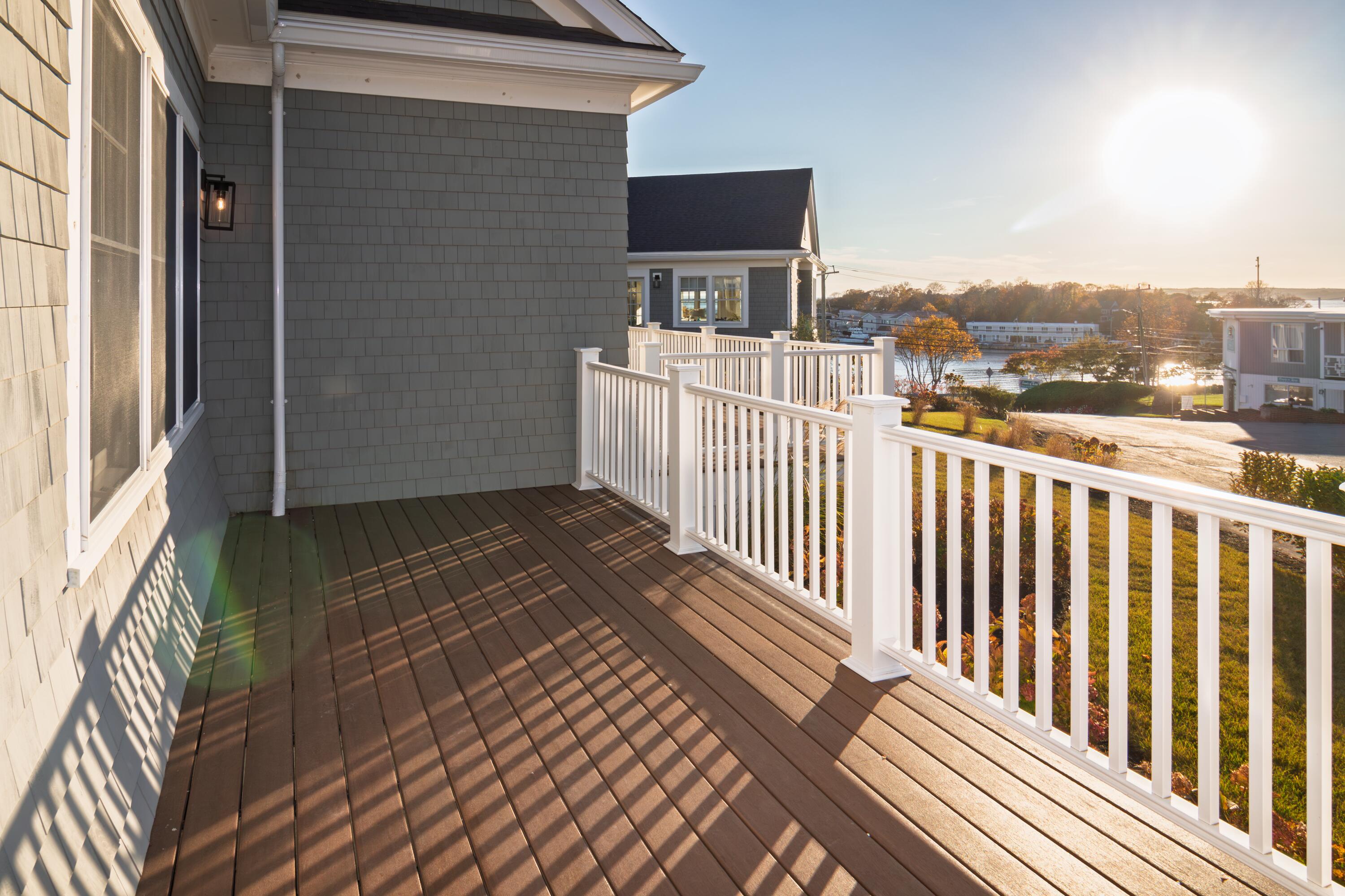 a view of a balcony with wooden floor