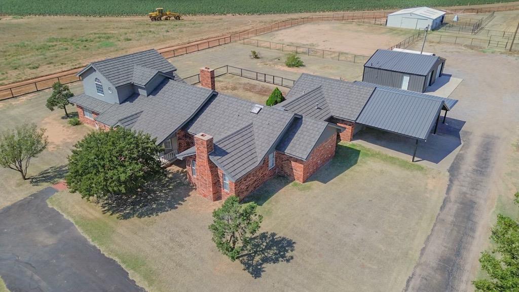 an aerial view of houses with backyard