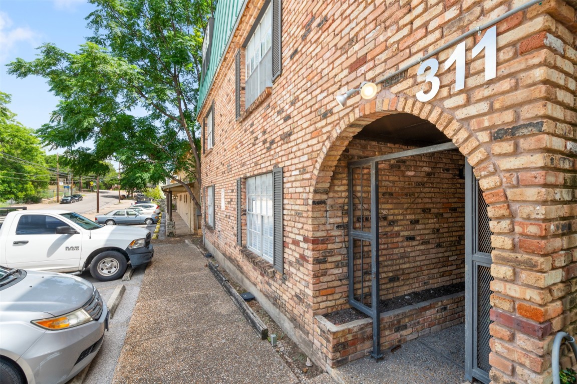 a front view of a house with parking area