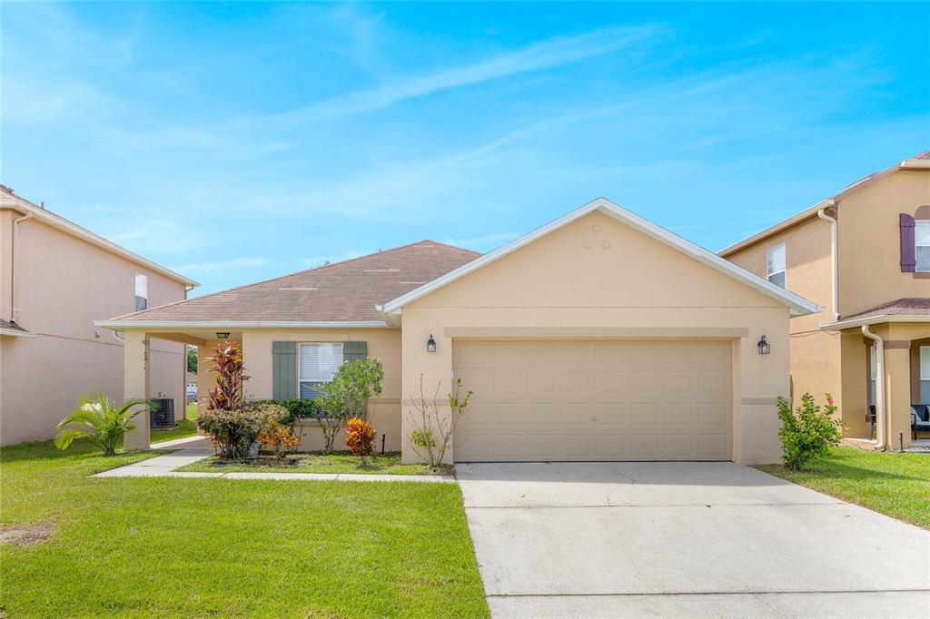 a front view of house with yard and outdoor seating