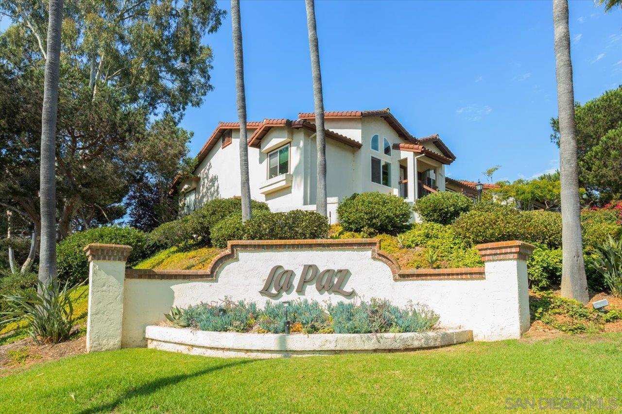 a front view of a house with a yard fountain