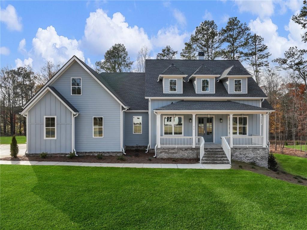 a front view of a house with a yard