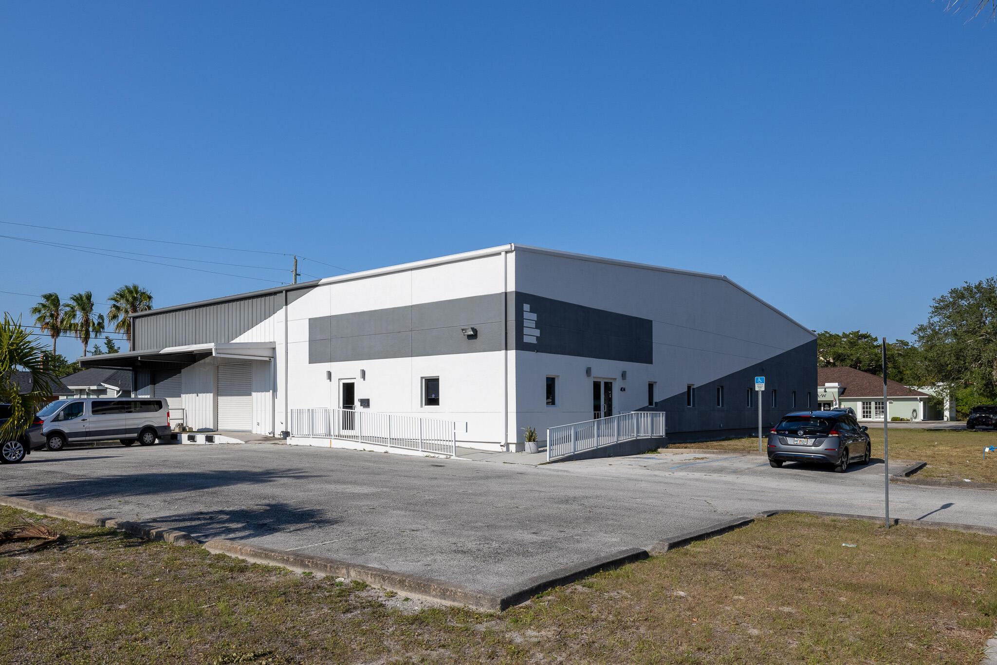 a view of building with car parked