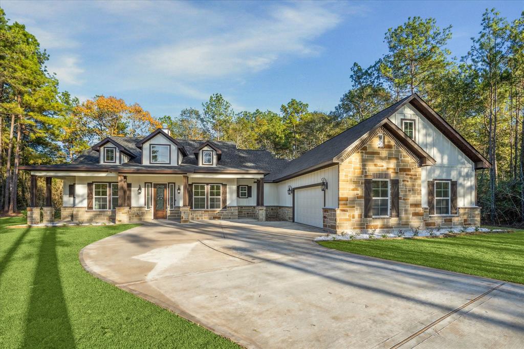 Lovely and inviting new construction home on 1 acre in beautiful Saddle Creek Forest.  Controlled access subdivision.   Grass sod yard with no-fuss white rock and flower beds. Home has stone and siding exterior.