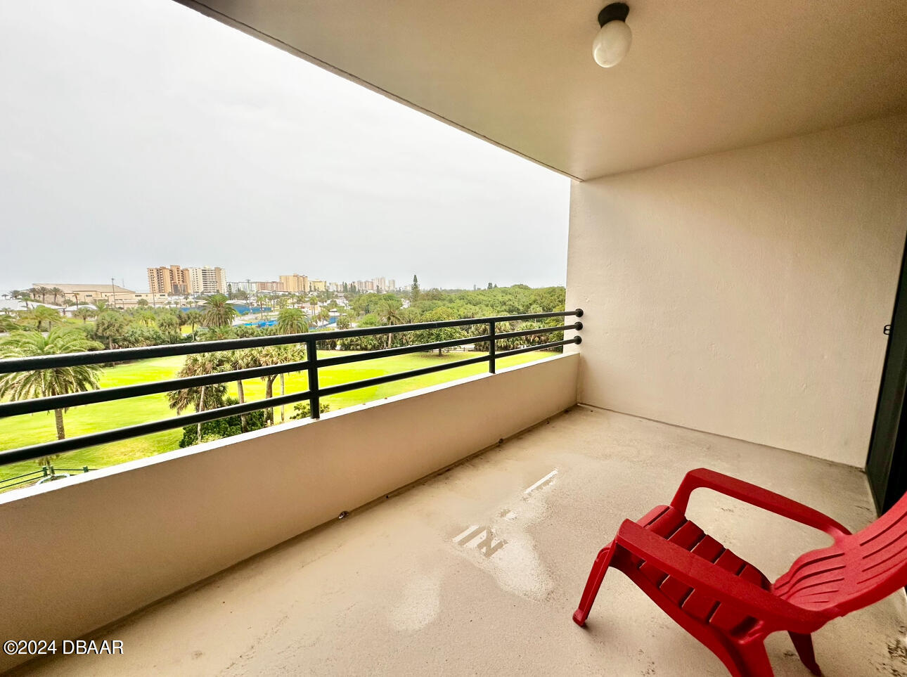 a view of balcony with furniture