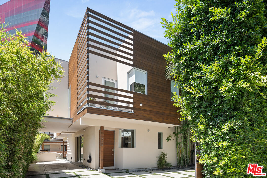 a view of a house with a tree