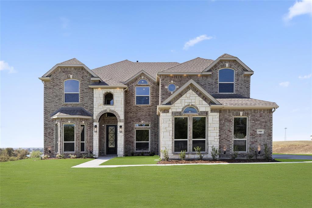 front view of a house with a yard