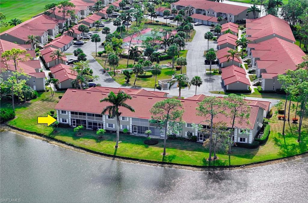 an aerial view of house with yard swimming pool and outdoor seating