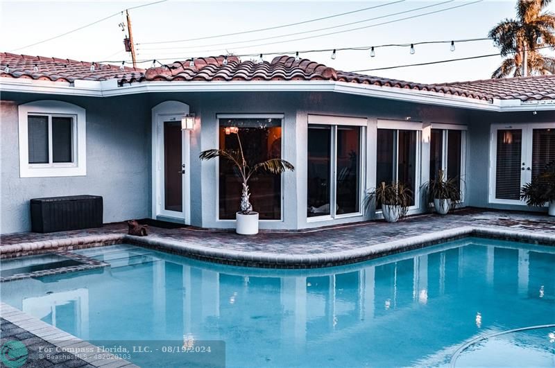 a view of a house with swimming pool