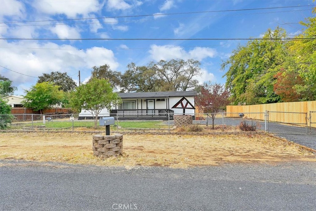 a view of a house with swimming pool and sitting area