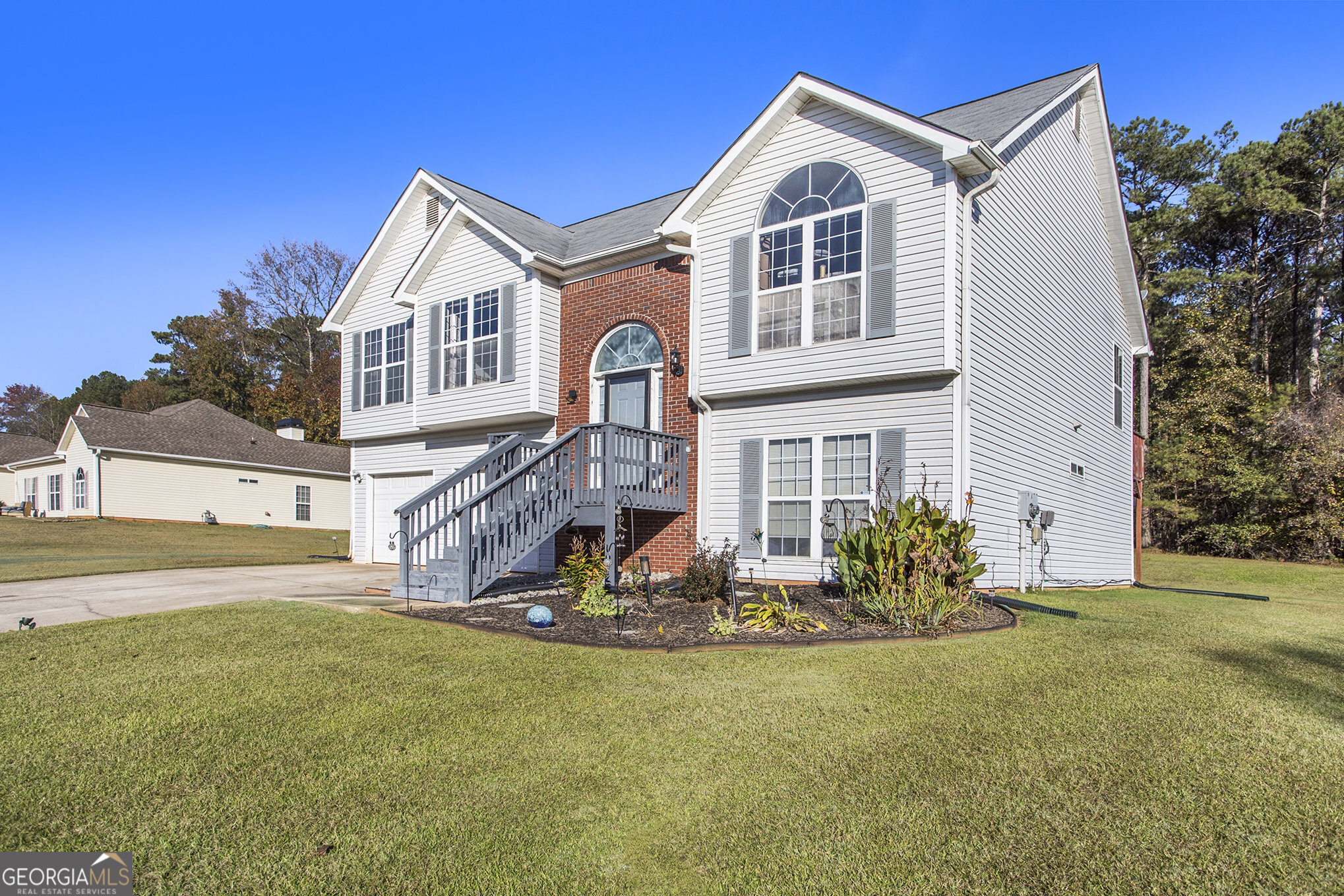 a front view of a house with a yard