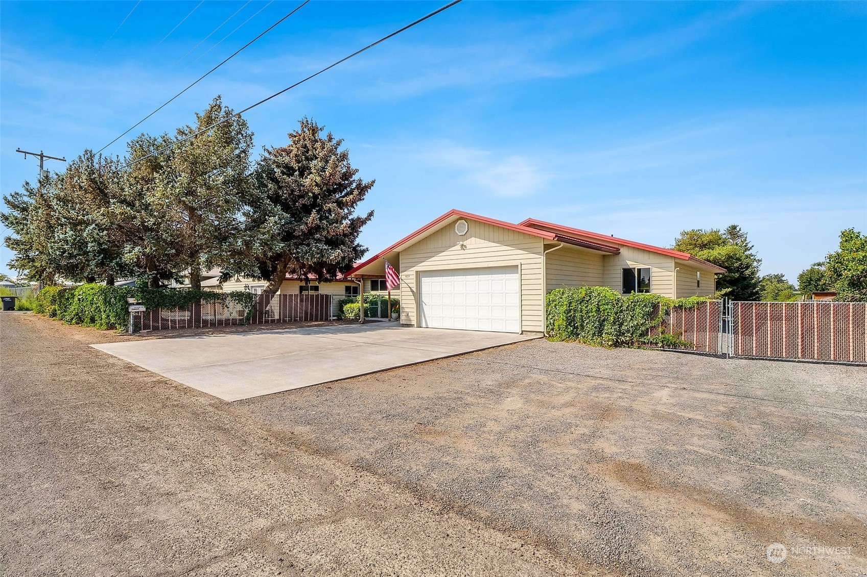 a view of a house with a yard and garage