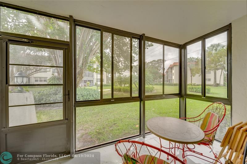 a view of a room with furniture and a window