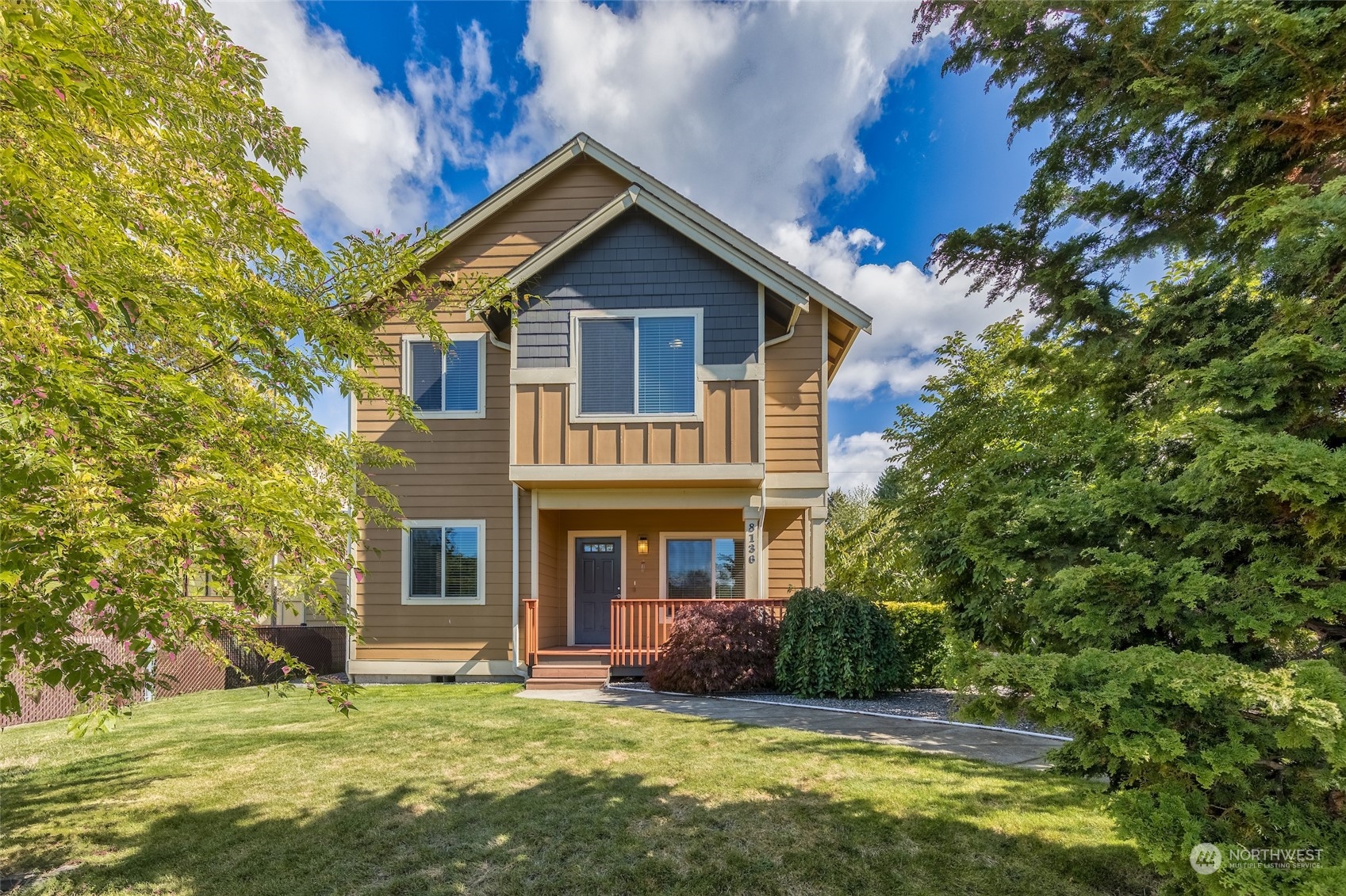 a front view of a house with a yard