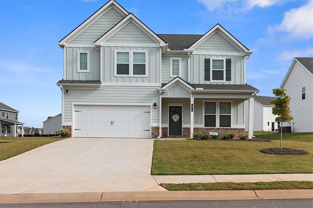 a front view of a house with a yard