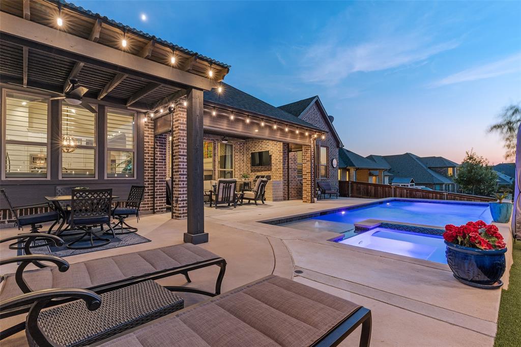 a view of a patio with swimming pool table and chairs