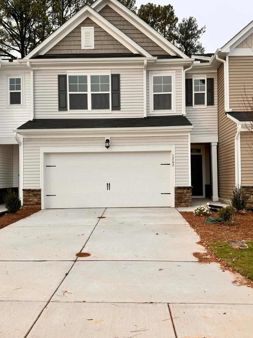 a front view of a house with a garage