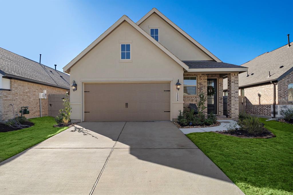 a backyard of a house with garden and garage