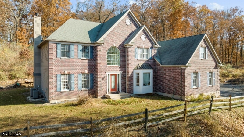 a view of house with yard