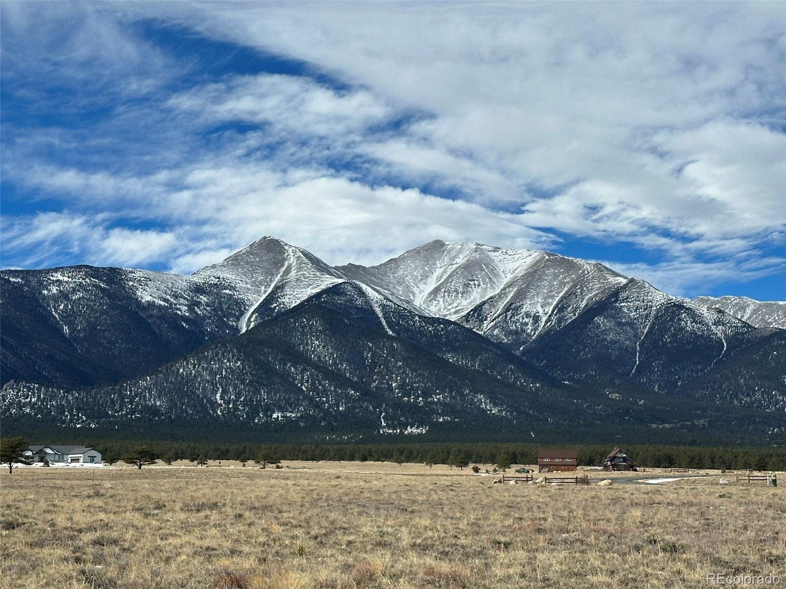 a view of a dry yard covered with snow