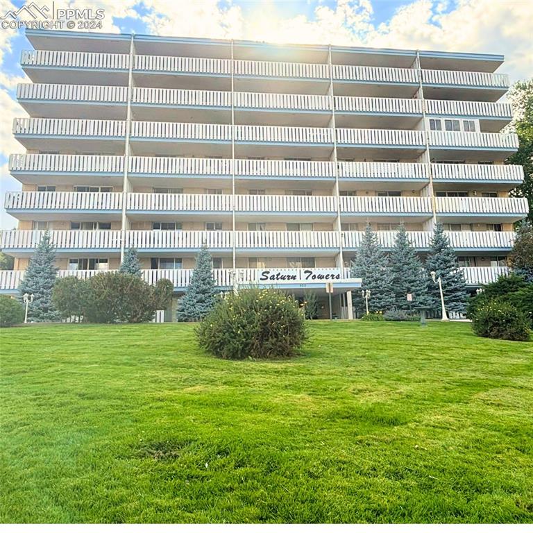 a view of a building with a garden