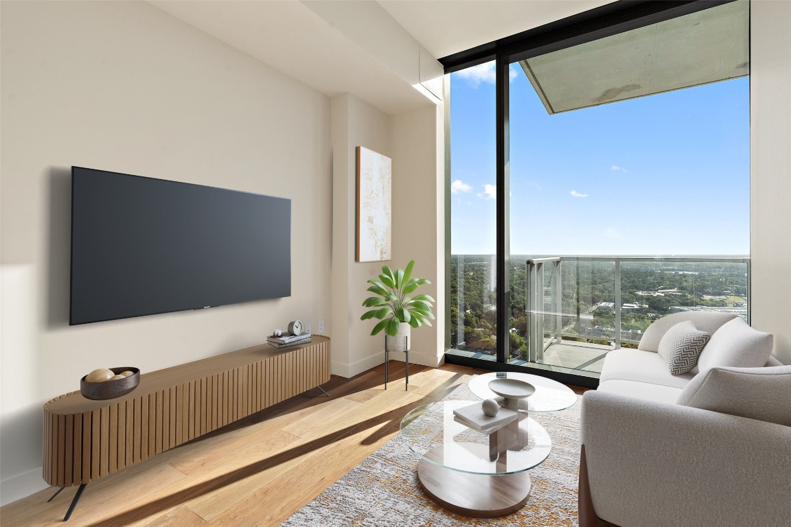 a living room with furniture and a flat screen tv