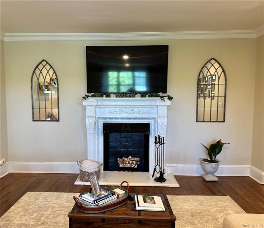 a living room with furniture fireplace and flat screen tv