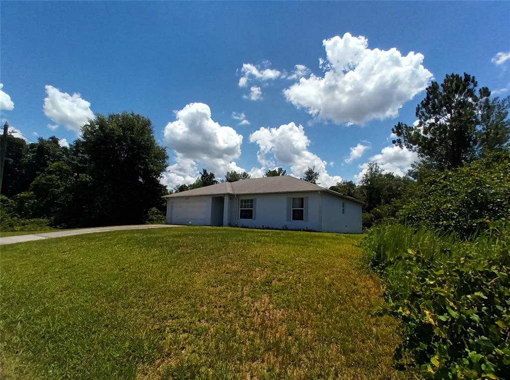 a view of a house with a big yard