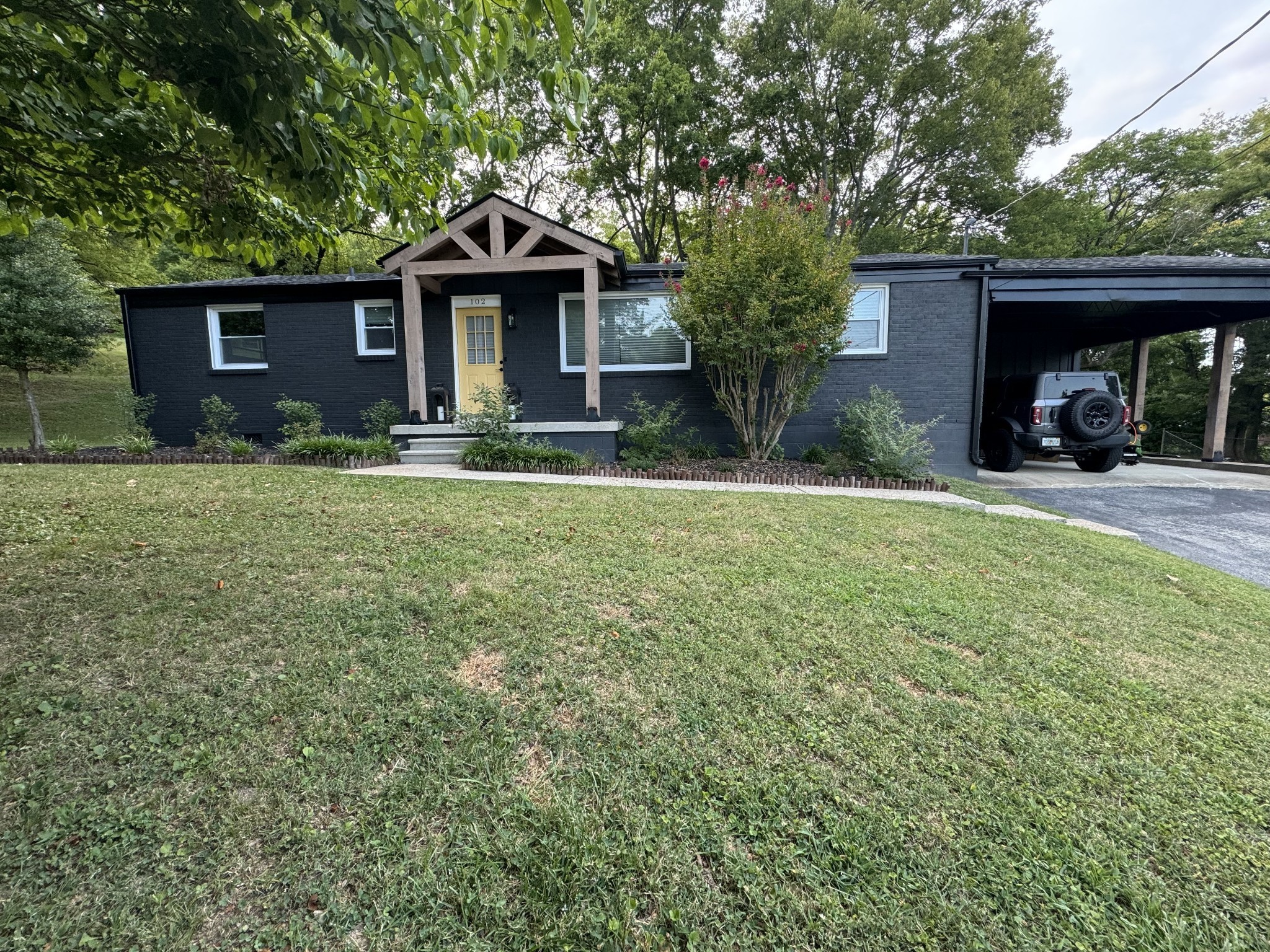 a front view of a house with a yard