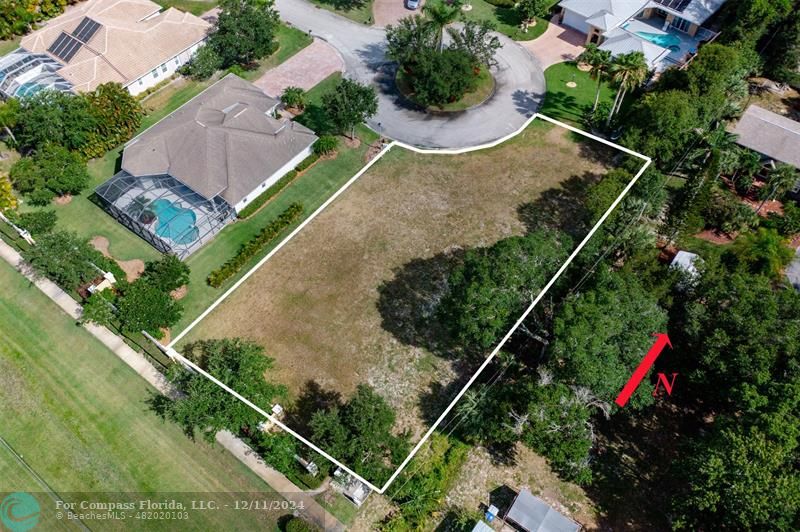 an aerial view of house with pool