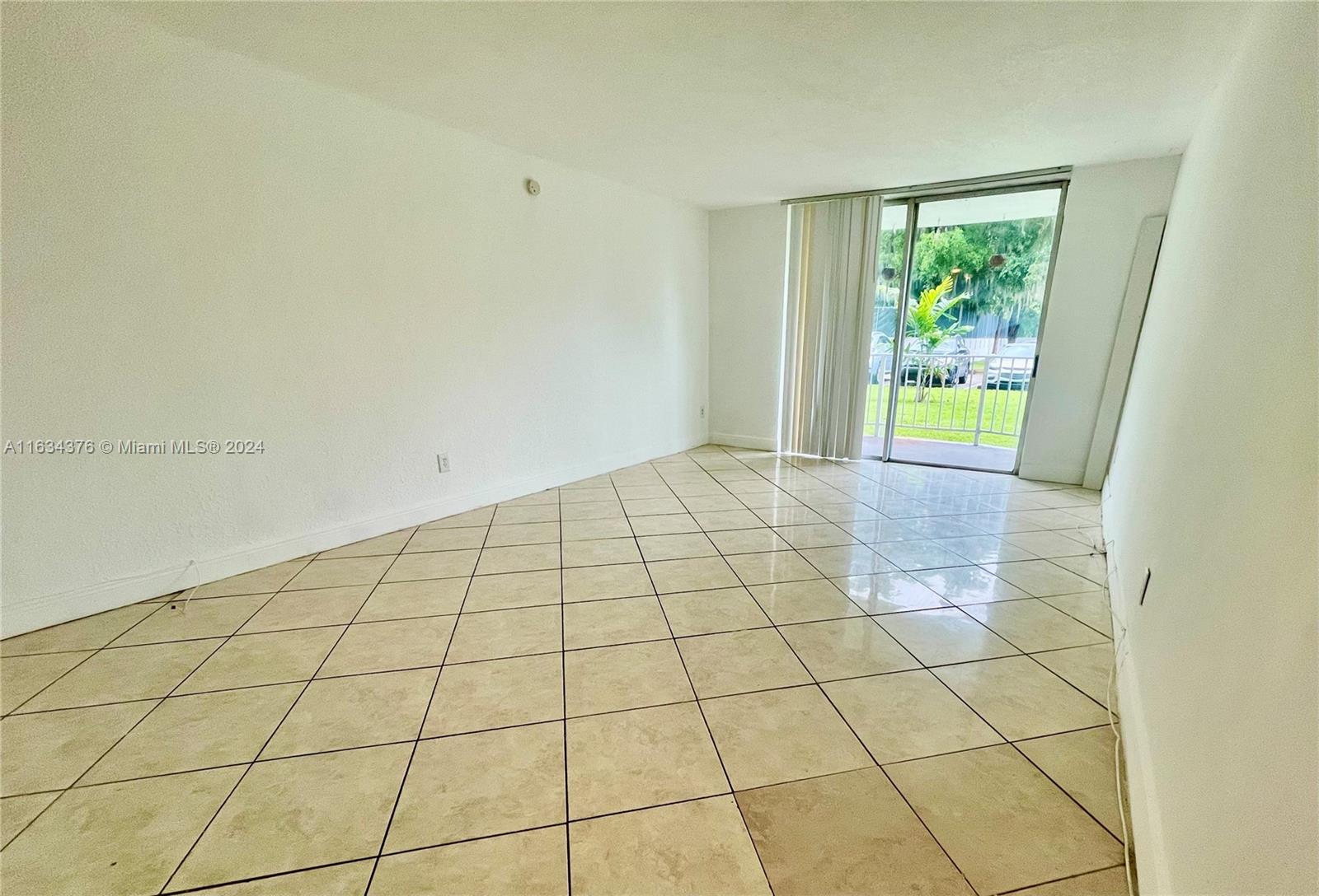 a view of an empty room and window