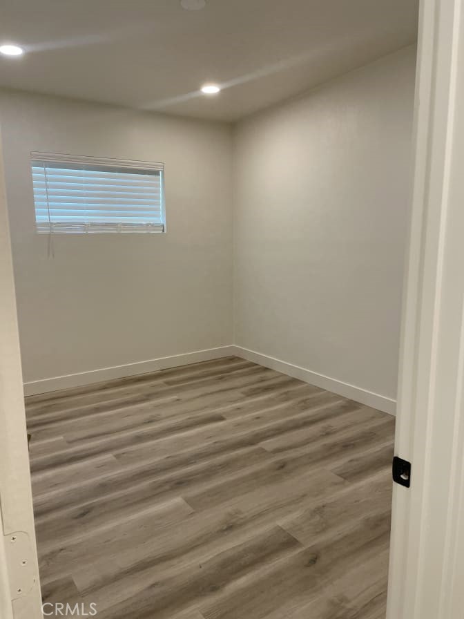 a view of room with window and hardwood floor