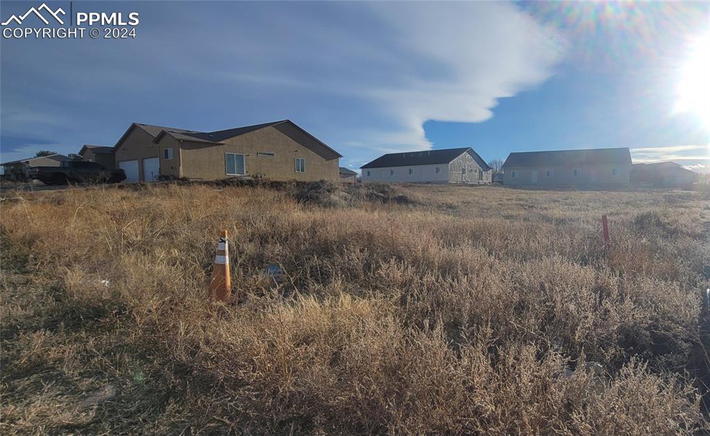 a view of a house in a field