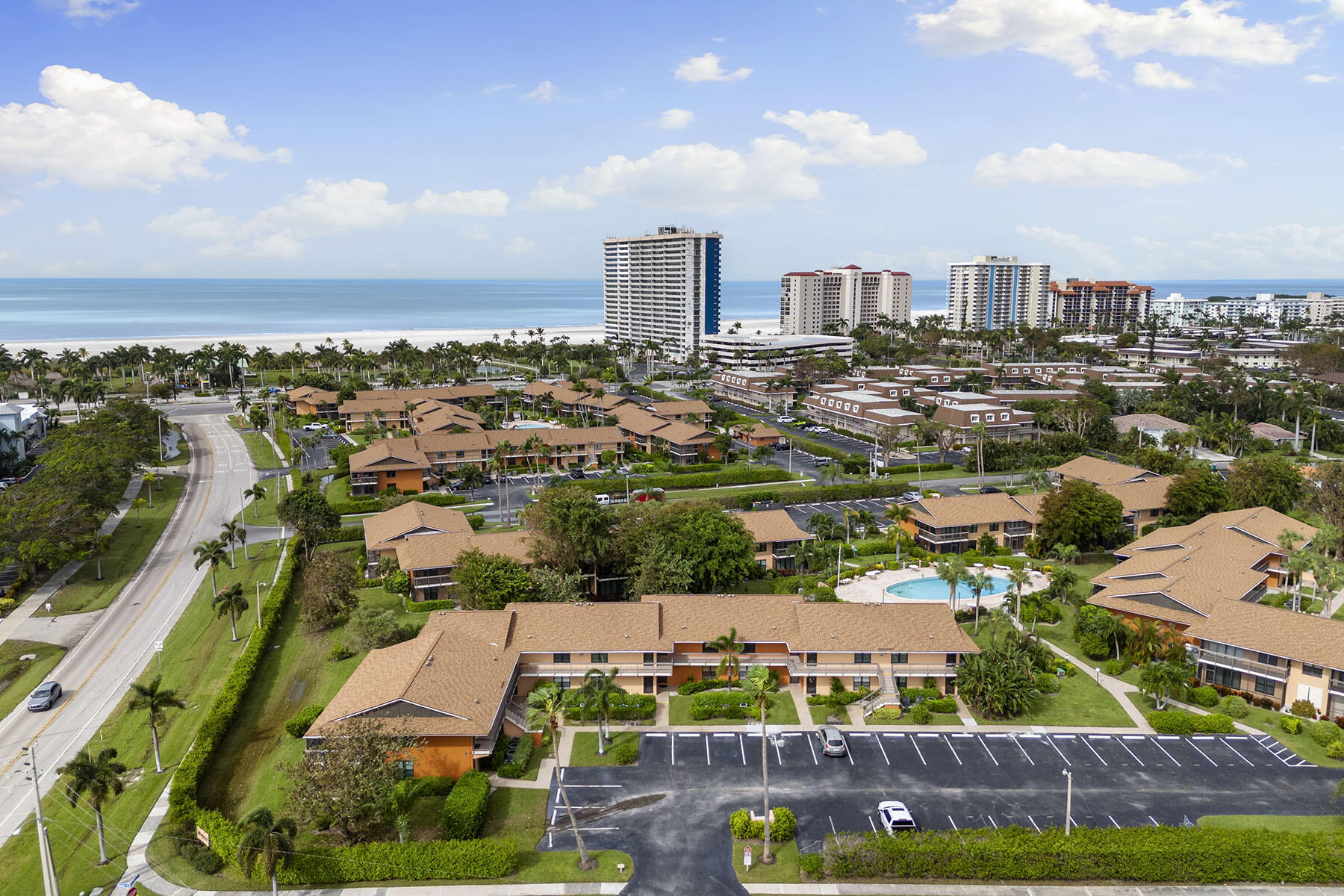 an aerial view of residential building and lake