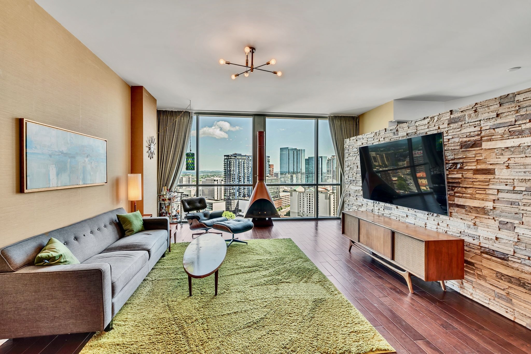 a living room with furniture and a flat screen tv