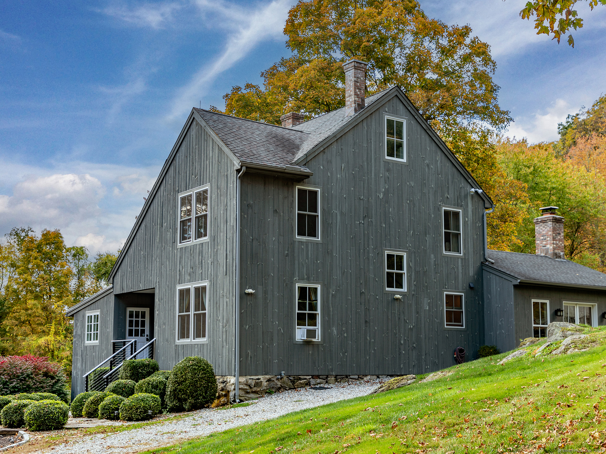 a front view of a house with garden