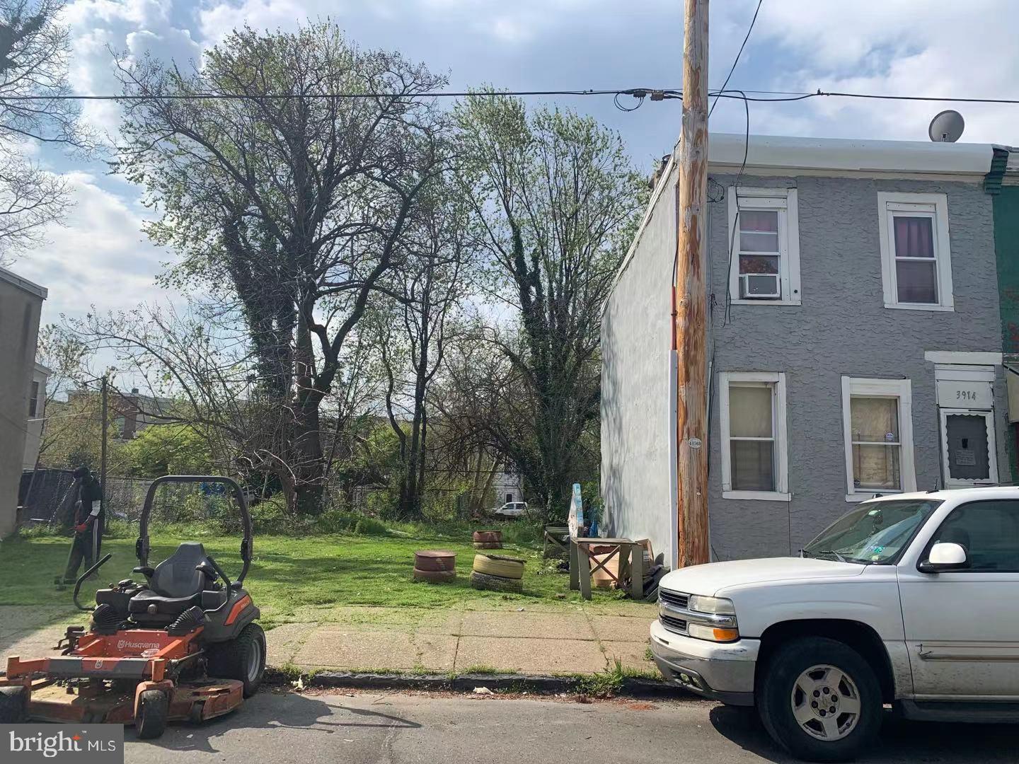 a car parked in front of a brick house