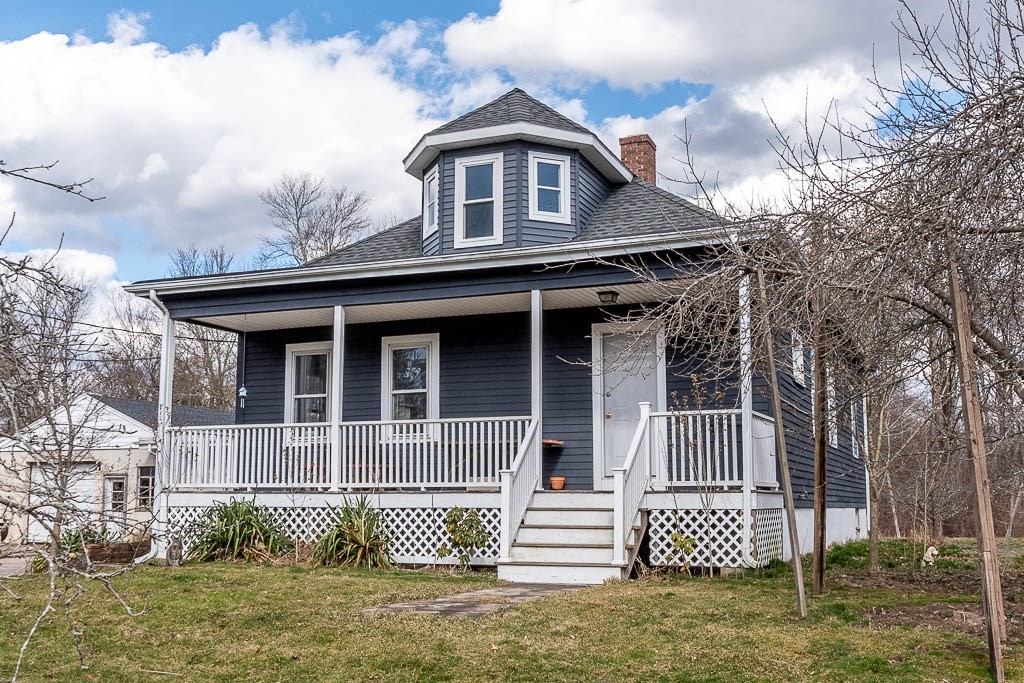 front view of a house with a fence