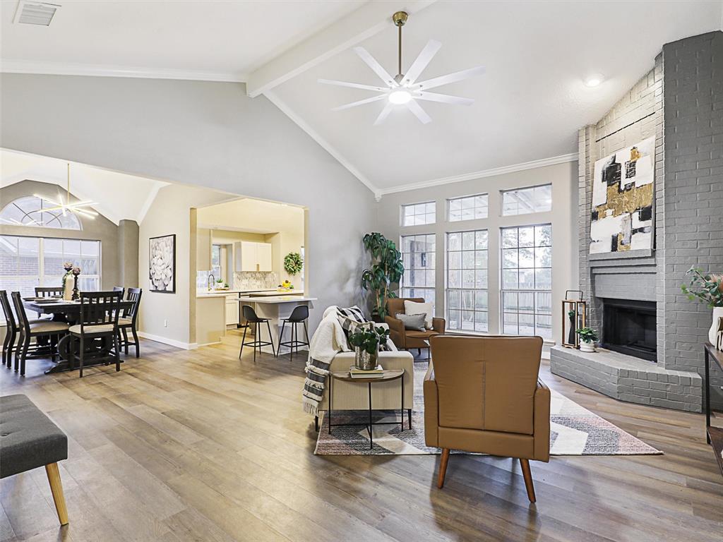 a living room with furniture a fireplace and window