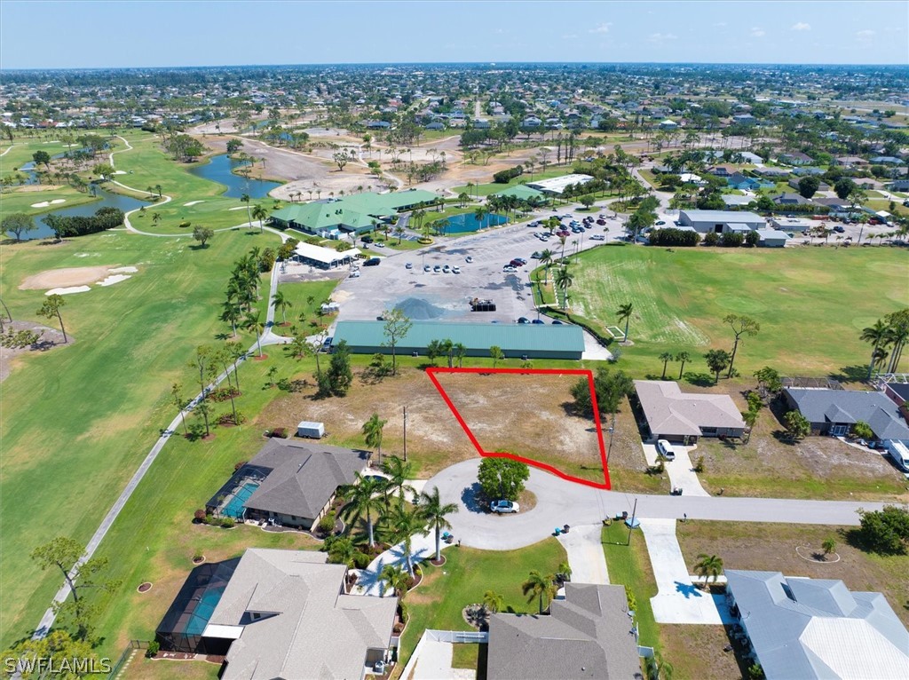 an aerial view of lake residential houses with outdoor space and swimming pool