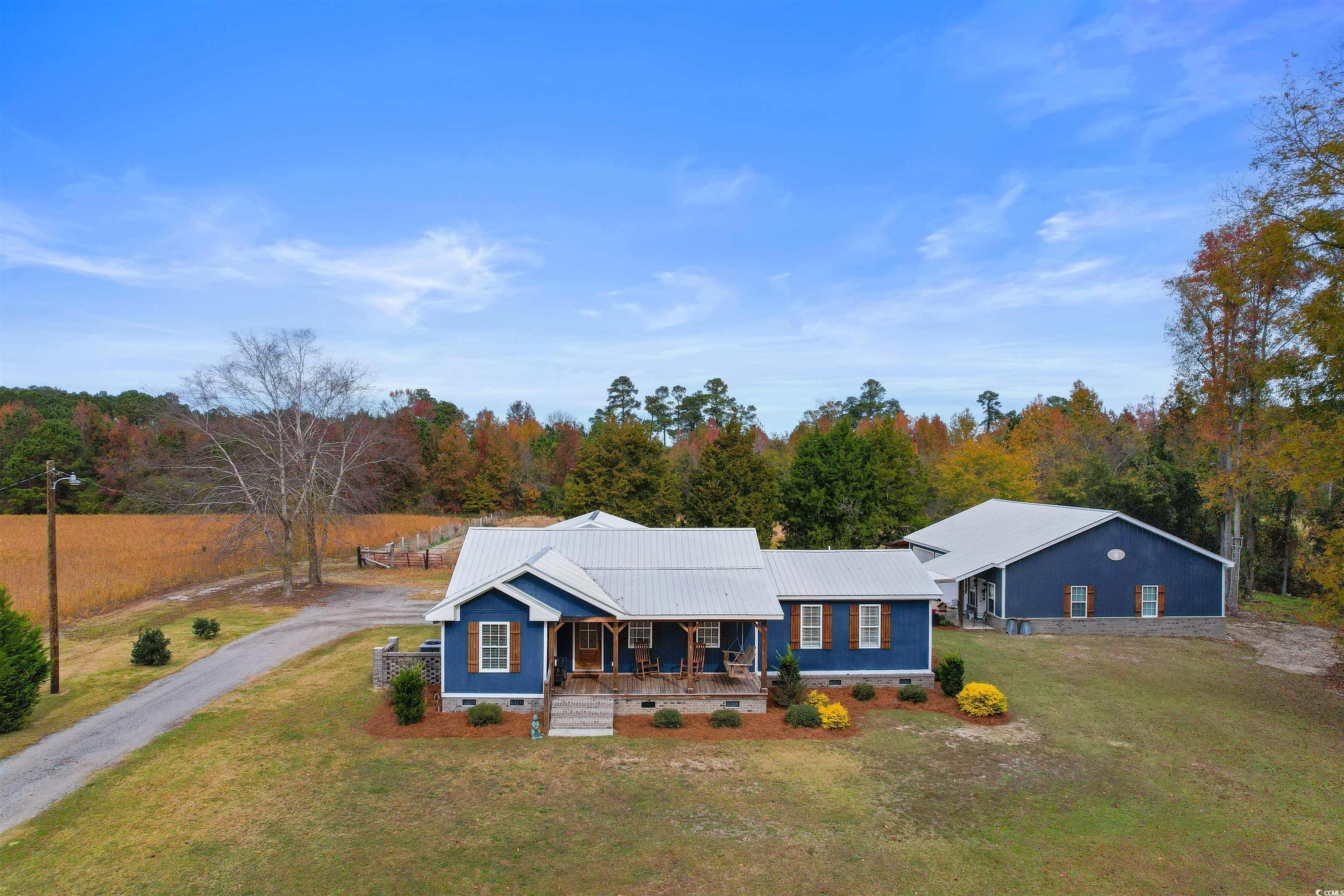 Single story home with covered porch and a front l