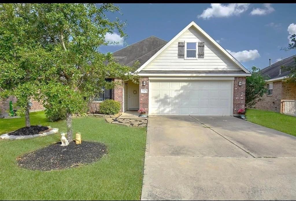 a front view of house with garden