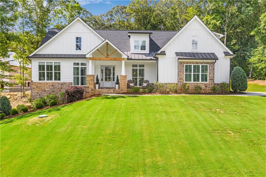 a front view of a house with a yard and garage