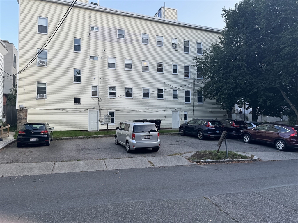 a view of a cars parked in front of a building