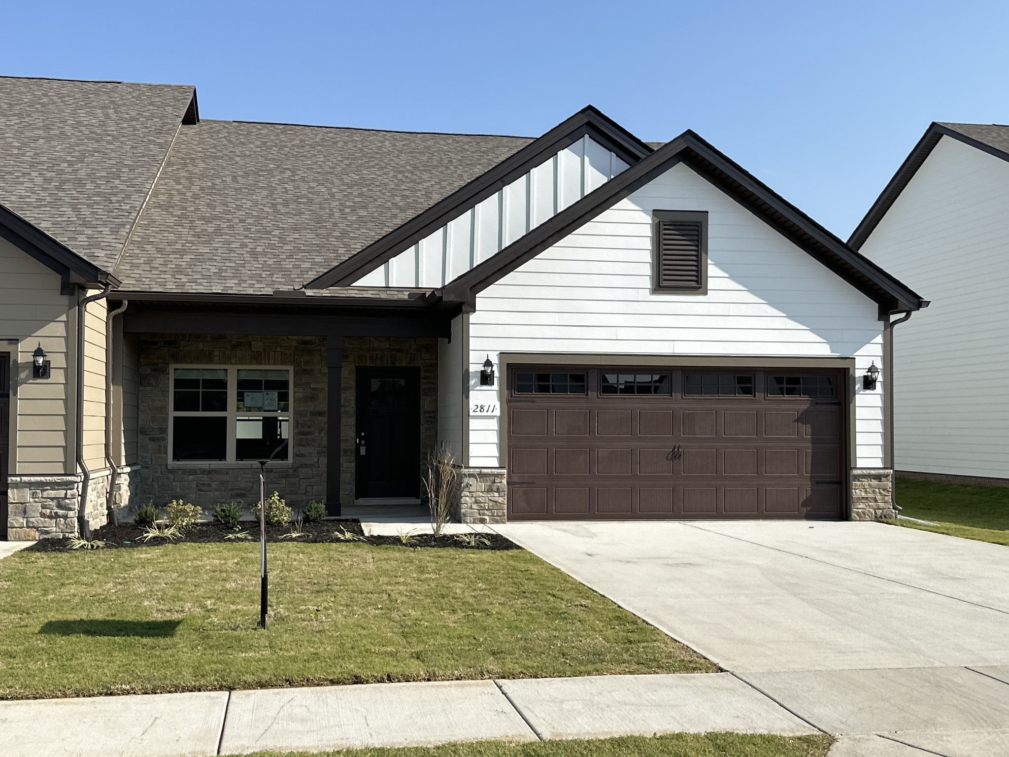 a front view of a house with a yard