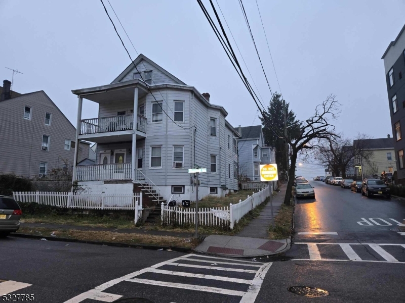 a front view of multiple houses with yard